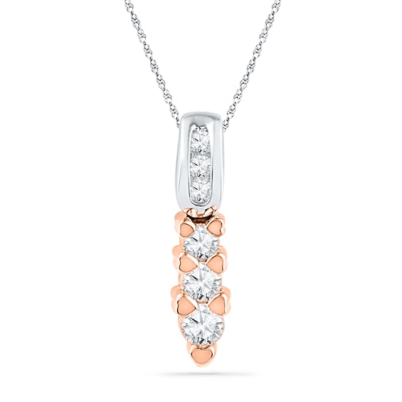 0.25 CT. T.w. Diamond Pendant with Heart-Shaped Accents in 10K