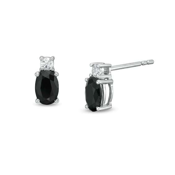 0.95 CT. T.w. Oval Black Enhanced and White Diamond Stud Earrings in